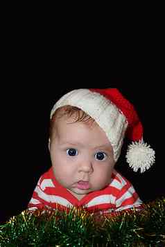 新生儿有趣的圣诞老人婴儿目瞪口呆脸孤立的黑色的