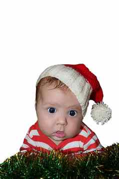 可爱的圣诞老人婴儿目瞪口呆脸穿着红色的萨纳塔他
