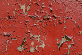木表面裂缝剥油漆芯片油漆红色的纹理背景