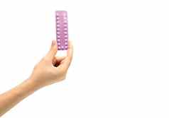 亚洲年轻的女人持有包避孕药片手孤立的白色背景复制空间剪裁路径选择家庭规划出生控制药丸概念