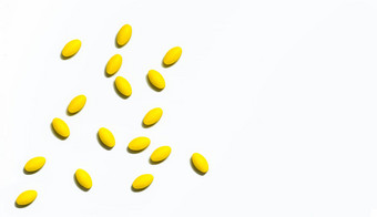 黄色的椭圆形平板电脑药片白色背景美丽的有创意的模式复制空间文本温和的温和的疼痛管理疼痛杀手医学