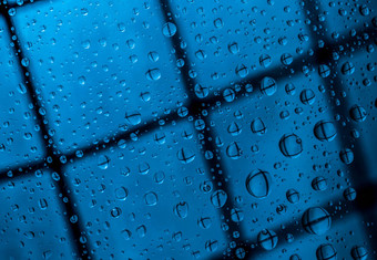蓝色的摘要模糊背景水滴反射透明的玻璃蓝色的背景孤独的伤心失踪多雨的一天概念