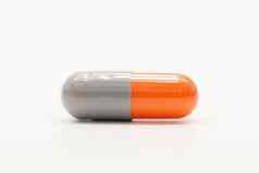 灰色橙色医学胶囊孤立的白色背景抗生素药物电阻制药行业药店背景抗菌医学