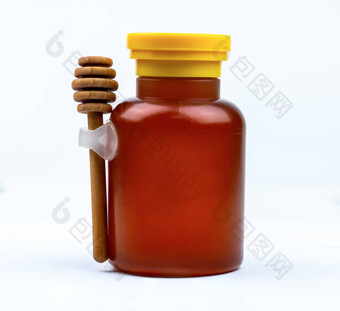 <strong>蜂蜜</strong>玻璃瓶黄色的帽木坚持孤立的白色背景空白标签<strong>美味</strong>的早餐食物概念包设计元素<strong>蜂蜜</strong>产品