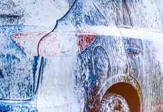 蓝色的紧凑的运动型多功能车车体育运动现代设计洗肥皂车覆盖白色泡沫车护理服务业务概念车洗泡沫玻璃打蜡玻璃涂层汽车