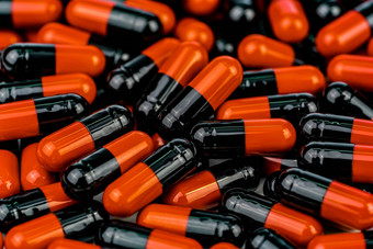 桩orange-black胶囊药片抗生素电阻药物合理的全球医疗保健概念抗生素药物电阻抗菌胶囊药片制药行业