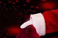 手圣诞老人老人持有袋孤立的圣诞节背景红色的星星