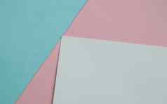 蓝色的粉红色的白色颜色纸几何平躺背景