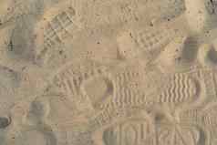 沙子海滩的足迹鞋子的足迹鞋子鞋子