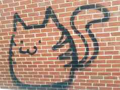猫动物涂鸦破坏公物红色的砖墙