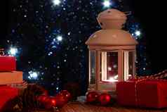 白色灯笼燃烧蜡烛盒子礼物背景圣诞节树灯美丽的圣诞节一年背景