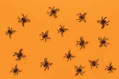 万圣节平躺模式黑色的蜘蛛橙色背景最小的风格水平糖果概念