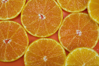 新鲜的切片多汁的橙色水果集橙色背景热带橙色水果纹理背景