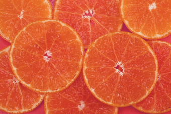 新鲜的切片多汁的橙色水果集橙色背景热带橙色水果纹理背景