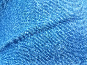 蓝色的牛仔布珍织物纺织折痕