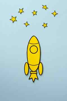 黄色的卡通火箭飞行空间蓝色的背景