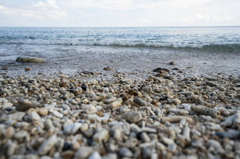 关闭圆形的抛光海滩岩石卵石石头海色彩斑斓的卵石石头