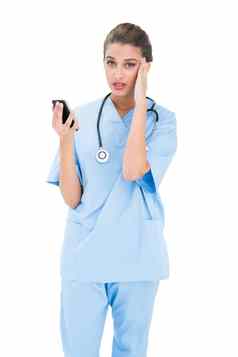 困惑棕色（的）头发的护士蓝色的实习医生风云移动电话