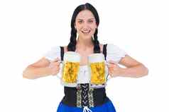 漂亮的啤酒节女孩持有啤酒酒杯