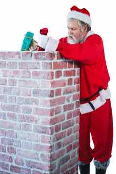 圣诞老人老人放置礼物盒子烟囱