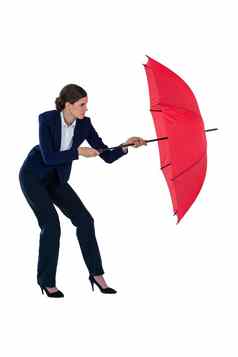 女商人持有红色的伞