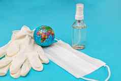 保护医疗面具手套酒精消毒剂地球蓝色的背景概念战斗预防检疫冠状病毒流感感染视图平躺