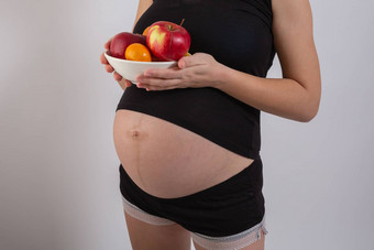怀孕健康的有机营养怀孕了女人持有新鲜的维生素水果免费的空间的地方文本概念期望健康