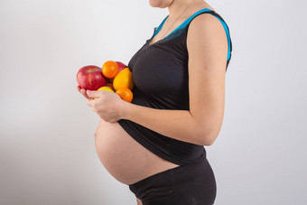 怀孕健康的有机营养怀孕了女人持有新鲜的维生素水果免费的空间的地方文本概念期望健康