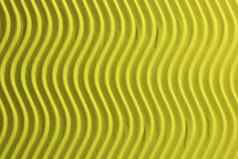 黄色的纸垂直波纹理压花波详细的纸背景波纹波浪纸板背景