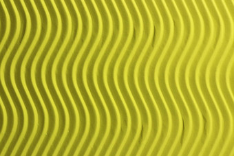 黄色的纸垂直波纹理<strong>压花</strong>波详细的纸背景波纹波浪纸板背景