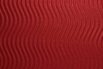 红色的纸垂直波纹理<strong>压花</strong>波详细的纸背景波纹波浪纸板背景