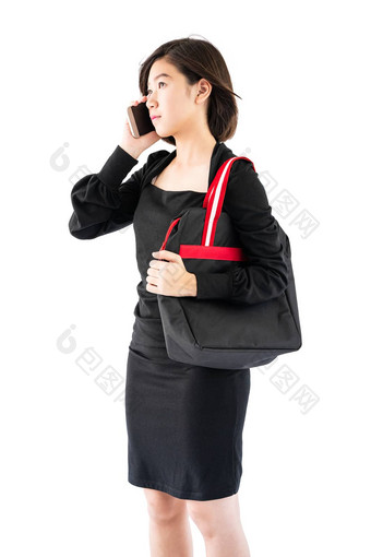 女人携带黑色的购物袋手机购物onl
