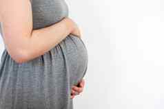 怀孕了女人有爱心的分享爱婴儿触碰肚子