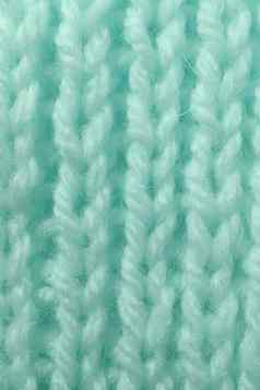 薄荷羊毛针织纹理垂直编织用钩针编织详细的行毛衣纺织背景宏特写镜头