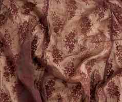 纹理皱巴巴的棕色（的）合成织物网络花边缝纫