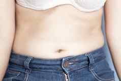 特写镜头腹部表面女人脂肪健康的护理美与