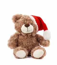 可爱的棕色（的）泰迪熊红色的圣诞节他坐在
