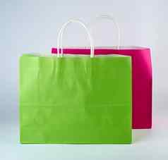 矩形粉红色的绿色纸购物袋处理