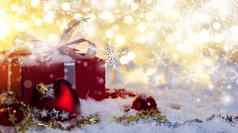 红色的礼物盒子雪散景背景圣诞节