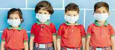 学校13岁以下的孩子们保护脸面具冠状病毒科维德法律顾问“非典”浸病毒学校孩子们穿医疗面具由于冠状病毒爆发