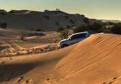 沙漠Safari日落阿拉伯沙子沙丘景观背景