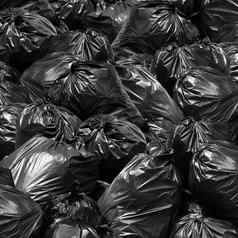 浪费背景垃圾袋黑色的本垃圾转储本垃圾垃圾垃圾塑料袋桩垃圾垃圾垃圾纹理