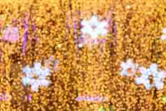 散景背景雪形状黄金黄色的色彩斑斓的快乐圣诞节快乐一年散景照明发光晚上背景散景闪闪发光的光黄金奢侈品背景纹理闪闪发光的壁纸
