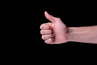 手欧洲人类显示拇指信号竖起大拇指标志孤立的黑色的背景