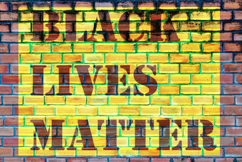 砖墙背景黑色的生活事口号解放班纳