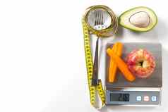 饮食计划菜单程序磁带测量饮食食物新鲜的水果白色背景重量损失排毒概念前视图重量损失概念苹果测量磁带饮食