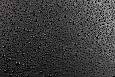 水滴摘要平黑色的疏水表面宏背景