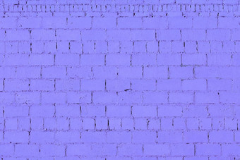 紫罗兰色的石膏粗糙的砖墙纹理