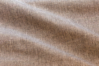 棕色（的）波密集的粗糙的织物特写镜头背景