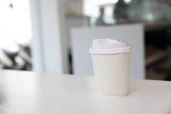 卡布奇诺咖啡咖啡咖啡纸杯白色语气咖啡店